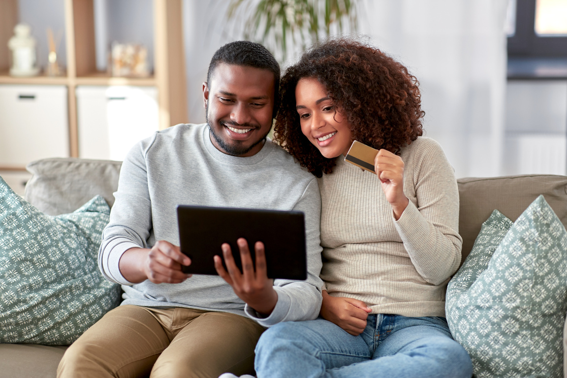 Couple Online Shopping on the Sofa